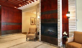 Lobby lounge area with fireplace at Days Inn Edmonton Downtown.