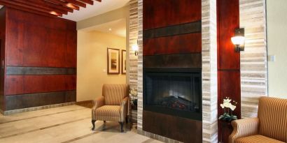 Lobby lounge area with fireplace at Days Inn Edmonton Downtown.