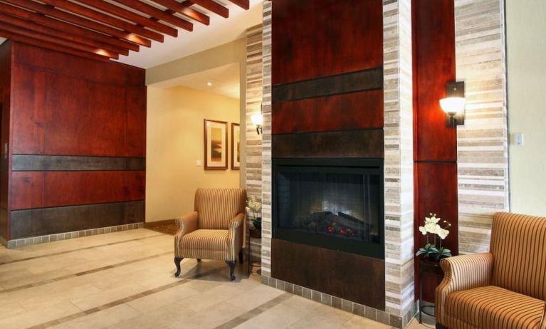 Lobby lounge area with fireplace at Days Inn Edmonton Downtown.