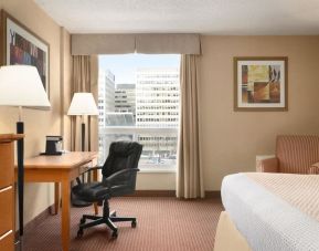 Bright and spacious day use room with TV, sofa, work desk and private bathroom at Days Inn Edmonton Downtown.