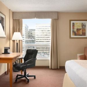 Bright and spacious day use room with TV, sofa, work desk and private bathroom at Days Inn Edmonton Downtown.