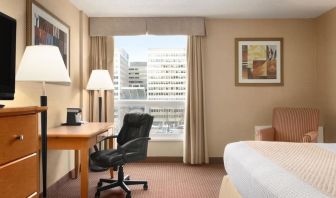 Bright and spacious day use room with TV, sofa, work desk and private bathroom at Days Inn Edmonton Downtown.