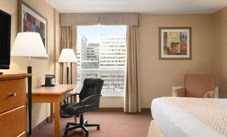 Bright and spacious day use room with TV, sofa, work desk and private bathroom at Days Inn Edmonton Downtown.