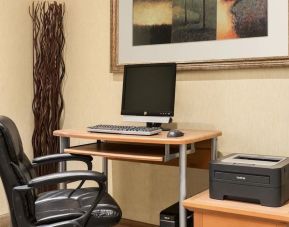 Business center with computer, printer and ergonomic chair at Days Inn Edmonton Downtown.