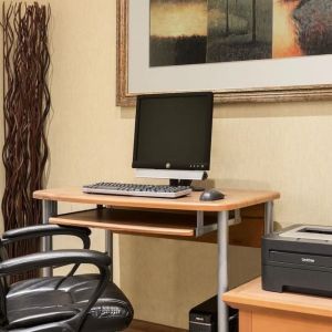 Business center with computer, printer and ergonomic chair at Days Inn Edmonton Downtown.