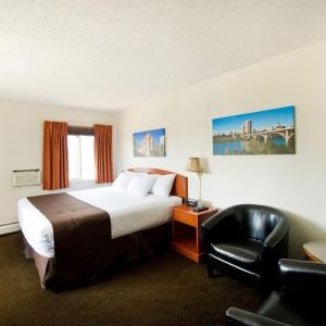 Day use room with lounge area, work desk and private bathroom at Riviera Motor Inn.