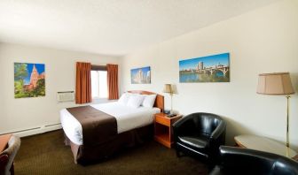 Day use room with lounge area, work desk and private bathroom at Riviera Motor Inn.