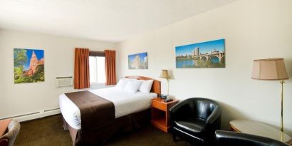 Day use room with lounge area, work desk and private bathroom at Riviera Motor Inn.