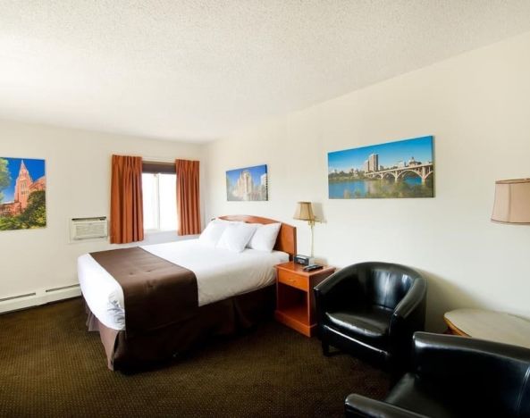 Day use room with lounge area, work desk and private bathroom at Riviera Motor Inn.