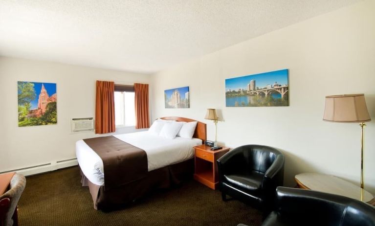 Day use room with lounge area, work desk and private bathroom at Riviera Motor Inn.