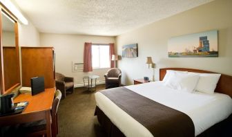 Day use room with living area, work desk and private bathroom at Riviera Motor Inn.