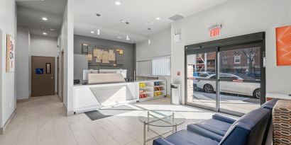 Reception area at Holiday Inn Express & Suites Bronx.