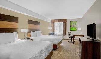 Day use twin room with TV, sofa, work desk and private bathroom at Days Inn & Suites By Wyndham Lindsay.