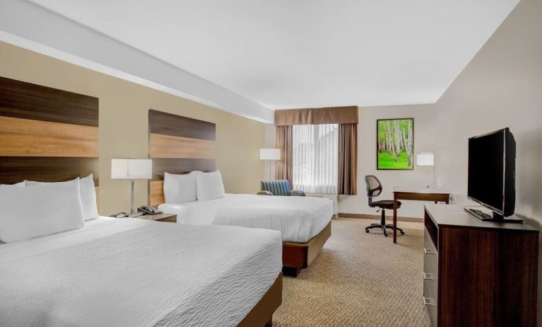 Day use twin room with TV, sofa, work desk and private bathroom at Days Inn & Suites By Wyndham Lindsay.