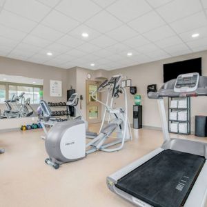 Fully equipped fitness center at Days Inn & Suites By Wyndham Lindsay.