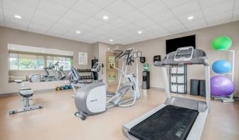 Fully equipped fitness center at Days Inn & Suites By Wyndham Lindsay.