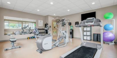 Fully equipped fitness center at Days Inn & Suites By Wyndham Lindsay.