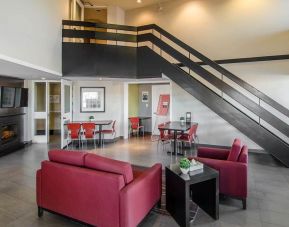 Hotel lobby and lounge area with fireplace, perfect for co-working at Comfort Inn Swift Current.