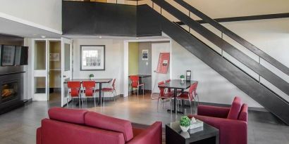 Hotel lobby and lounge area with fireplace, perfect for co-working at Comfort Inn Swift Current.