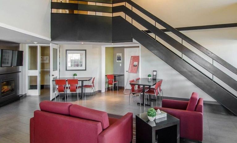 Hotel lobby and lounge area with fireplace, perfect for co-working at Comfort Inn Swift Current.