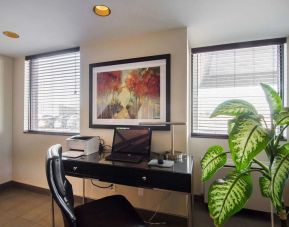 Business center with computer, printer and ergonomic chair at Comfort Inn Swift Current.