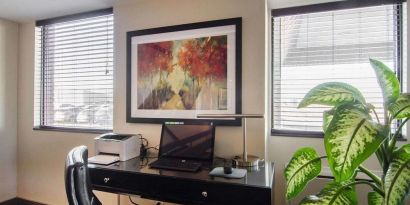 Business center with computer, printer and ergonomic chair at Comfort Inn Swift Current.