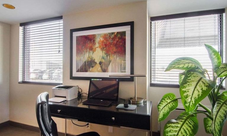 Business center with computer, printer and ergonomic chair at Comfort Inn Swift Current.