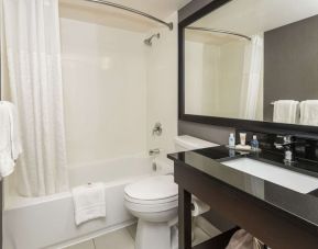 Guest bathroom with tub and free toiletries at Comfort Inn Sudbury Regent Street.