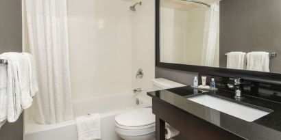 Guest bathroom with tub and free toiletries at Comfort Inn Sudbury Regent Street.