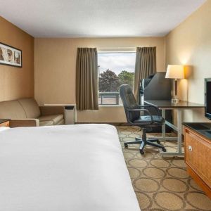 Day use room with TV, sofa, work desk and private bathroom at Comfort Inn Simcoe.