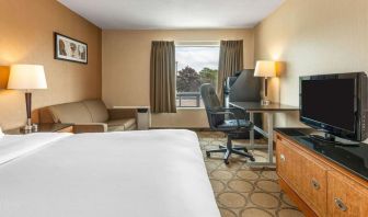 Day use room with TV, sofa, work desk and private bathroom at Comfort Inn Simcoe.