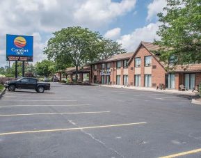 Hotel exterior and parking area at Comfort Inn Simcoe.