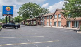 Hotel exterior and parking area at Comfort Inn Simcoe.