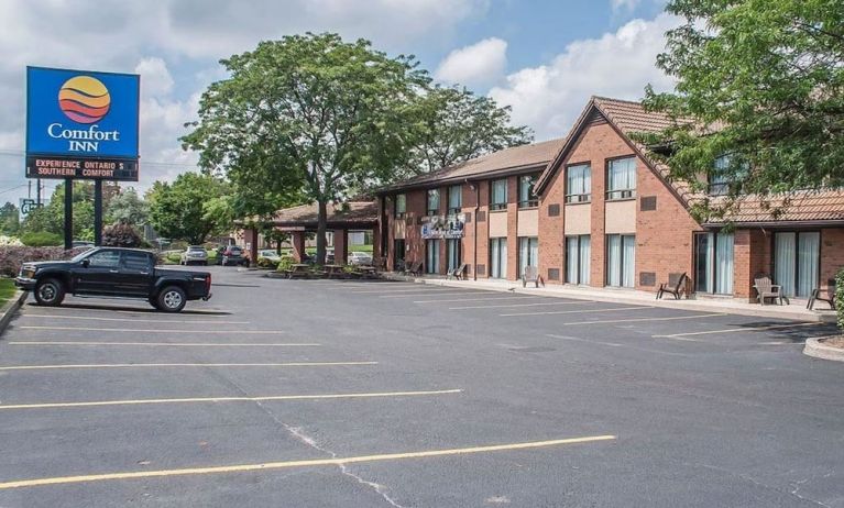 Hotel exterior and parking area at Comfort Inn Simcoe.