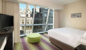 Floor-to-ceiling windows in a day use room at Best Western Premier Herald Square.