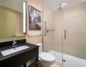 Guest bathroom with shower at Best Western Premier Herald Square.