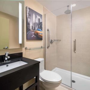 Guest bathroom with shower at Best Western Premier Herald Square.