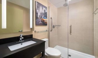 Guest bathroom with shower at Best Western Premier Herald Square.