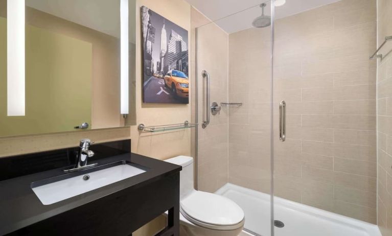 Guest bathroom with shower at Best Western Premier Herald Square.