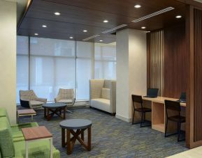 Lobby lounge with workspace at Holiday Inn Express Toronto Downtown.