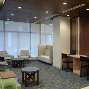 Lobby lounge with workspace at Holiday Inn Express Toronto Downtown.