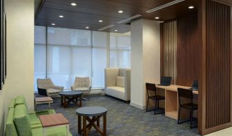 Lobby lounge with workspace at Holiday Inn Express Toronto Downtown.