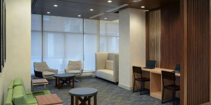 Lobby lounge with workspace at Holiday Inn Express Toronto Downtown.