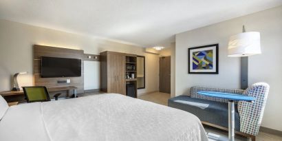 Day use room with TV, sofa, work desk and private bathroom at Holiday Inn Express Toronto Downtown.