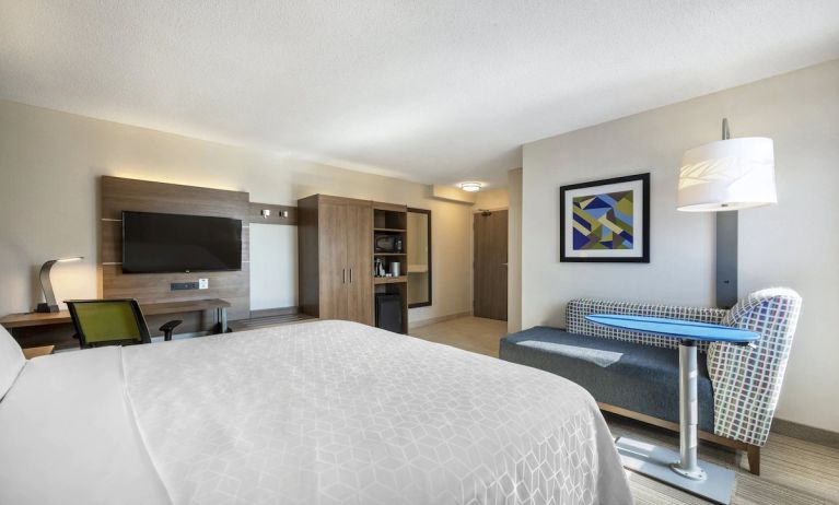 Day use room with TV, sofa, work desk and private bathroom at Holiday Inn Express Toronto Downtown.