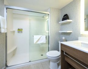 Guest bathroom with shower and free toiletries at Holiday Inn Express Toronto Downtown.