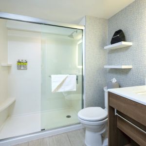 Guest bathroom with shower and free toiletries at Holiday Inn Express Toronto Downtown.