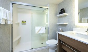 Guest bathroom with shower and free toiletries at Holiday Inn Express Toronto Downtown.