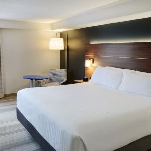 Day use toom with sofa, work desk and private bathroom at Holiday Inn Express Toronto Downtown.