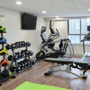 Fully equipped fitness center at Holiday Inn Express Toronto Downtown.